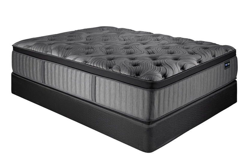 grey spring air mattress on foundation