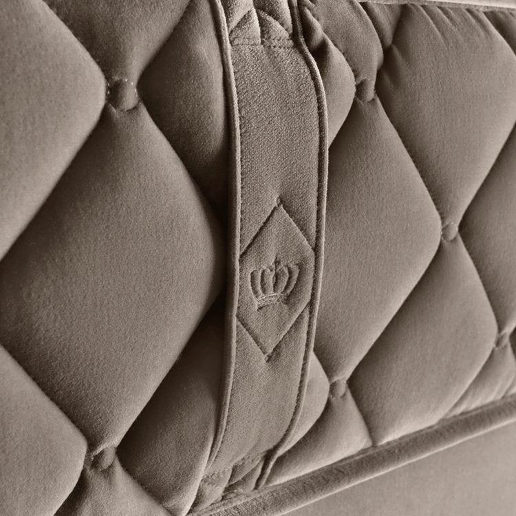 Finely woven cotton velvet border featuring custom Chesterfield quilting and seat belt stitch handles.