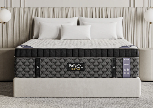 The premium Puffy Royal Hybrid luxury mattress displayed straight-on in our San Diego storefront layout.